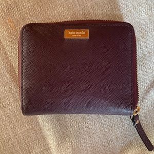 Kate Spade plum leather compact ziparound wallet